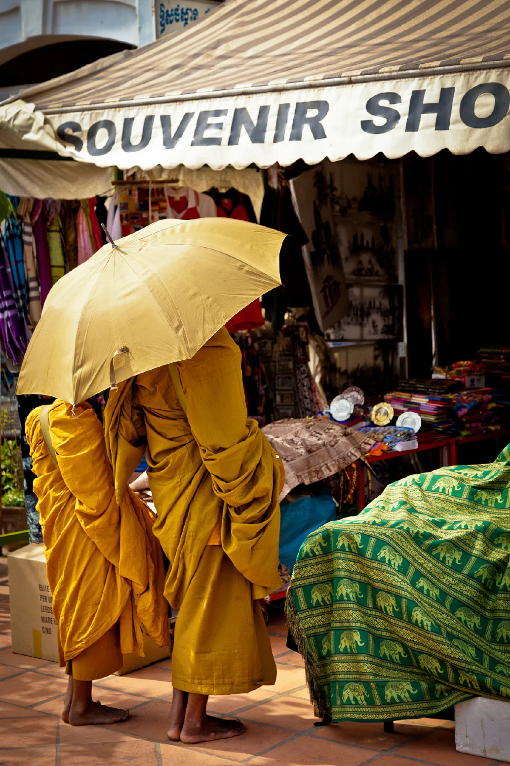 Two Monks and an Umbrella. Siem Reap, Cambodia. February 2012